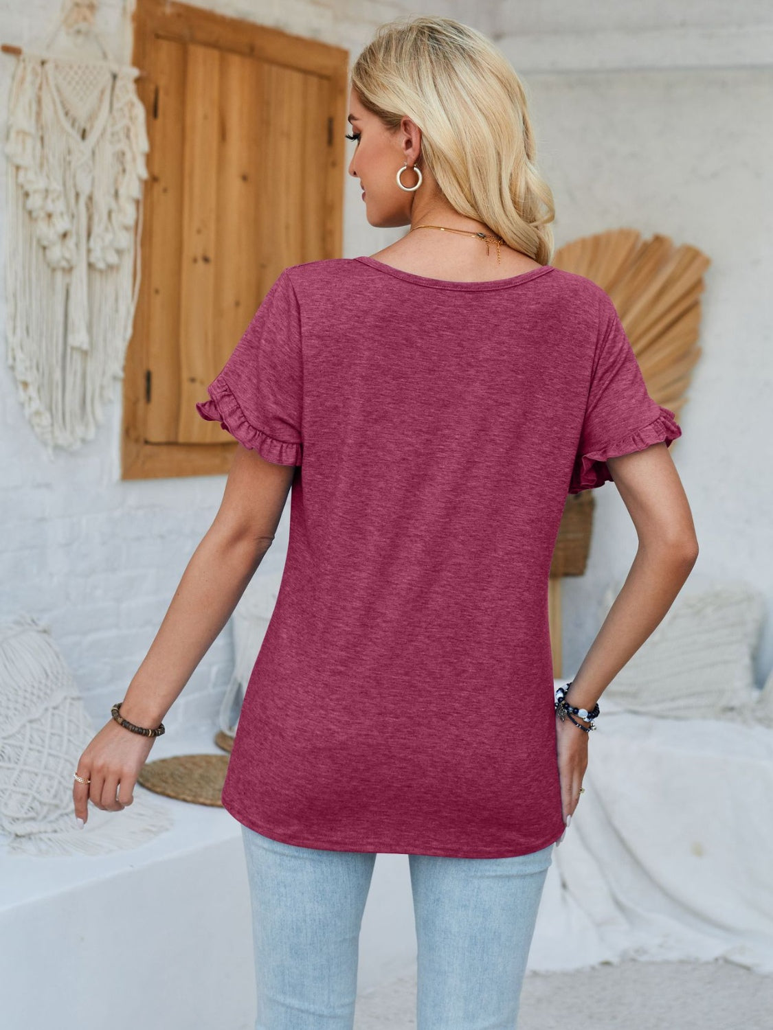 Frill round neck petal sleeve blouse.