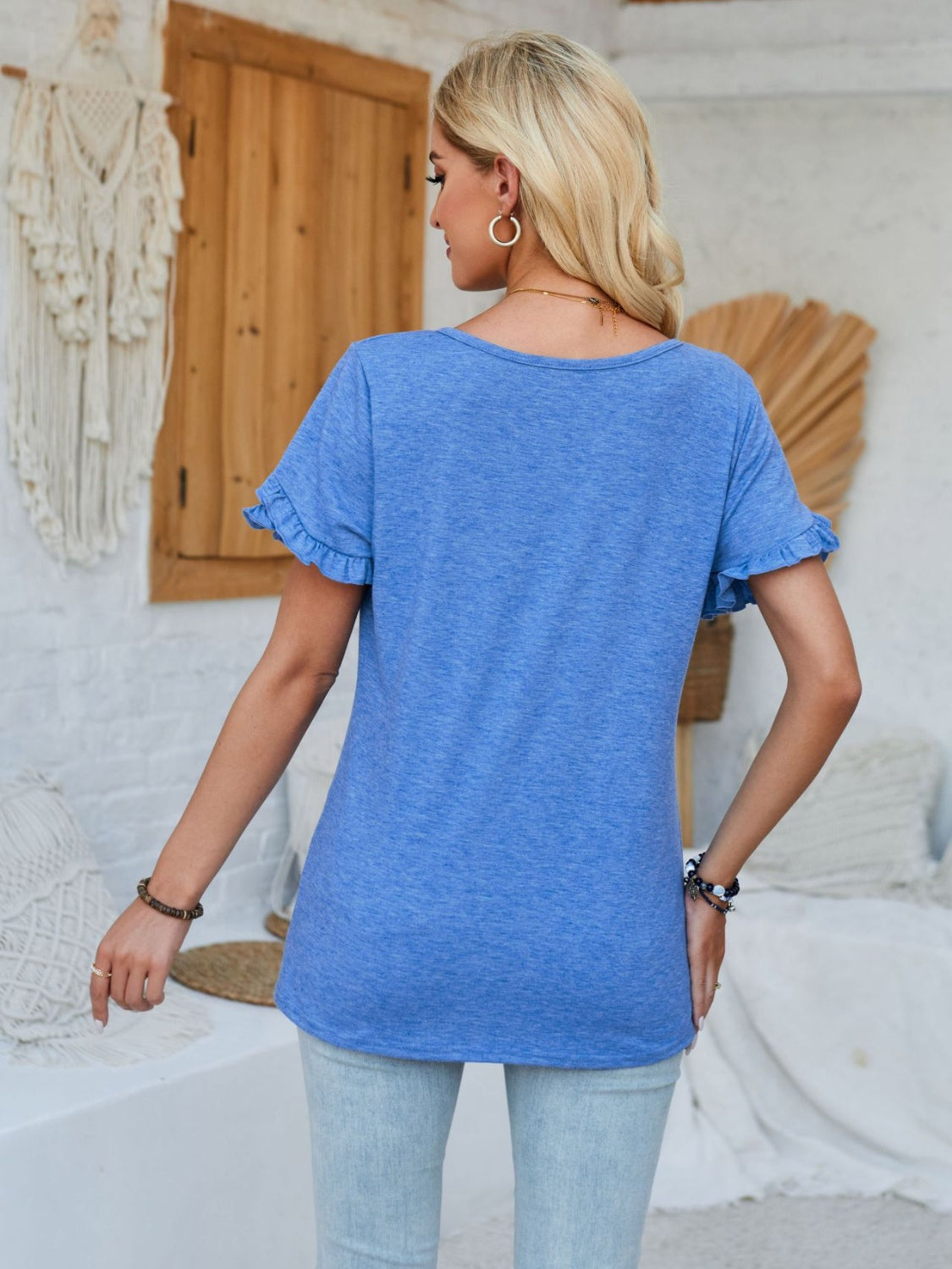 Frill round neck petal sleeve blouse.
