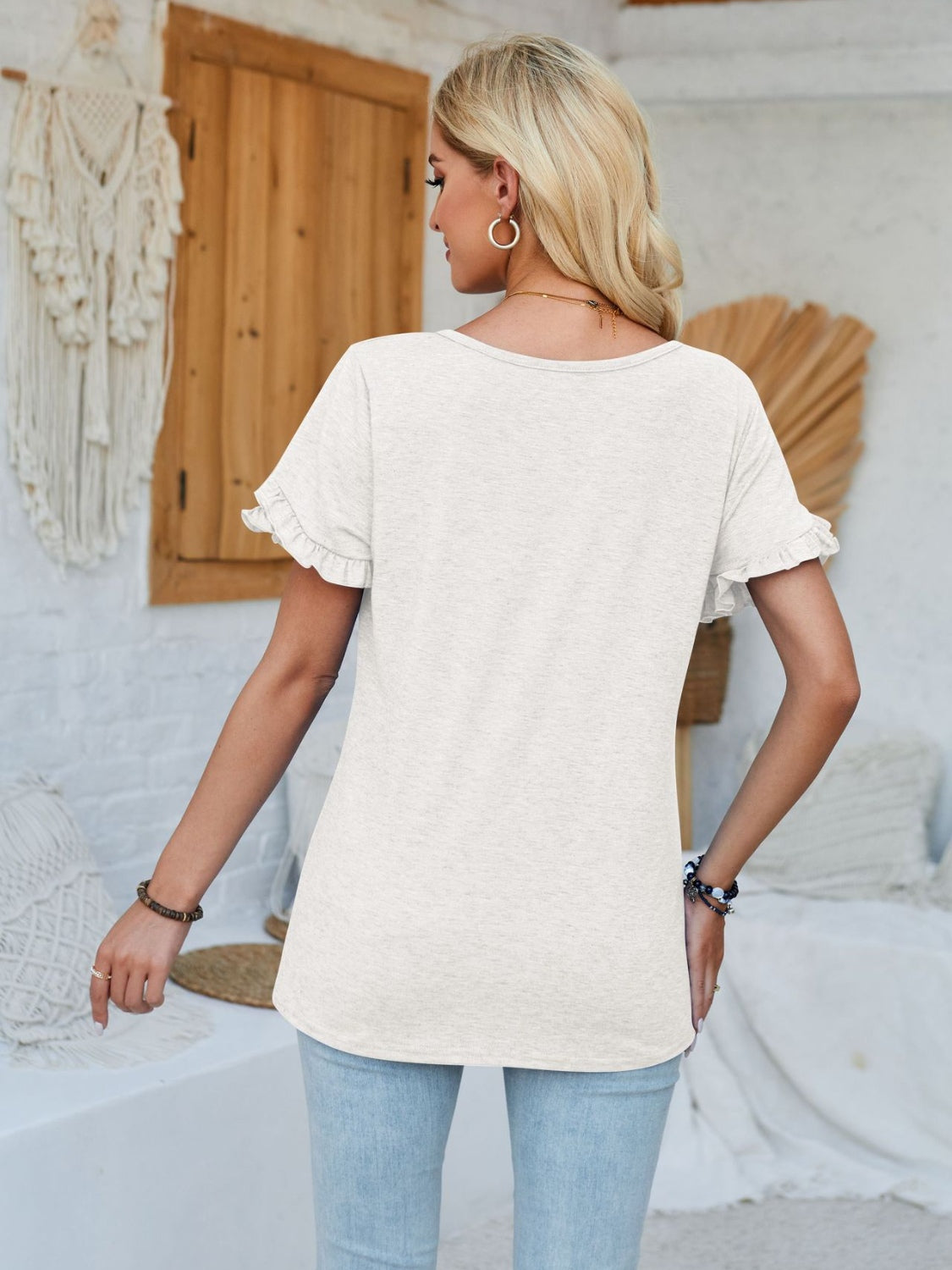 Frill round neck petal sleeve blouse.