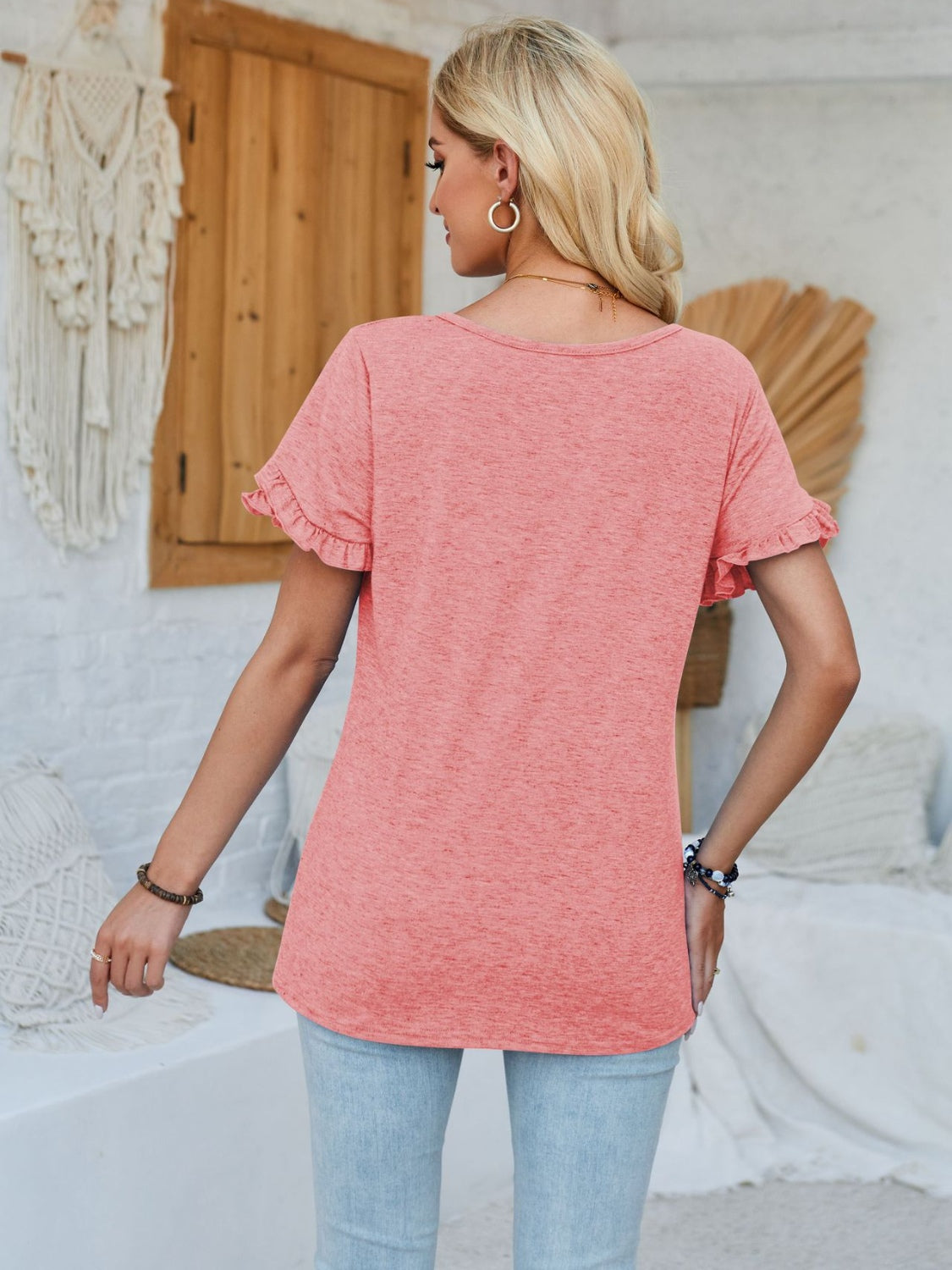 Frill round neck petal sleeve blouse.