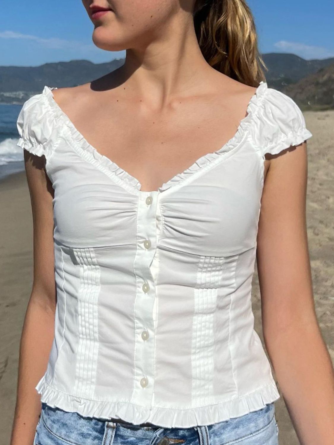 Devine frill V-neck cap sleeve top.