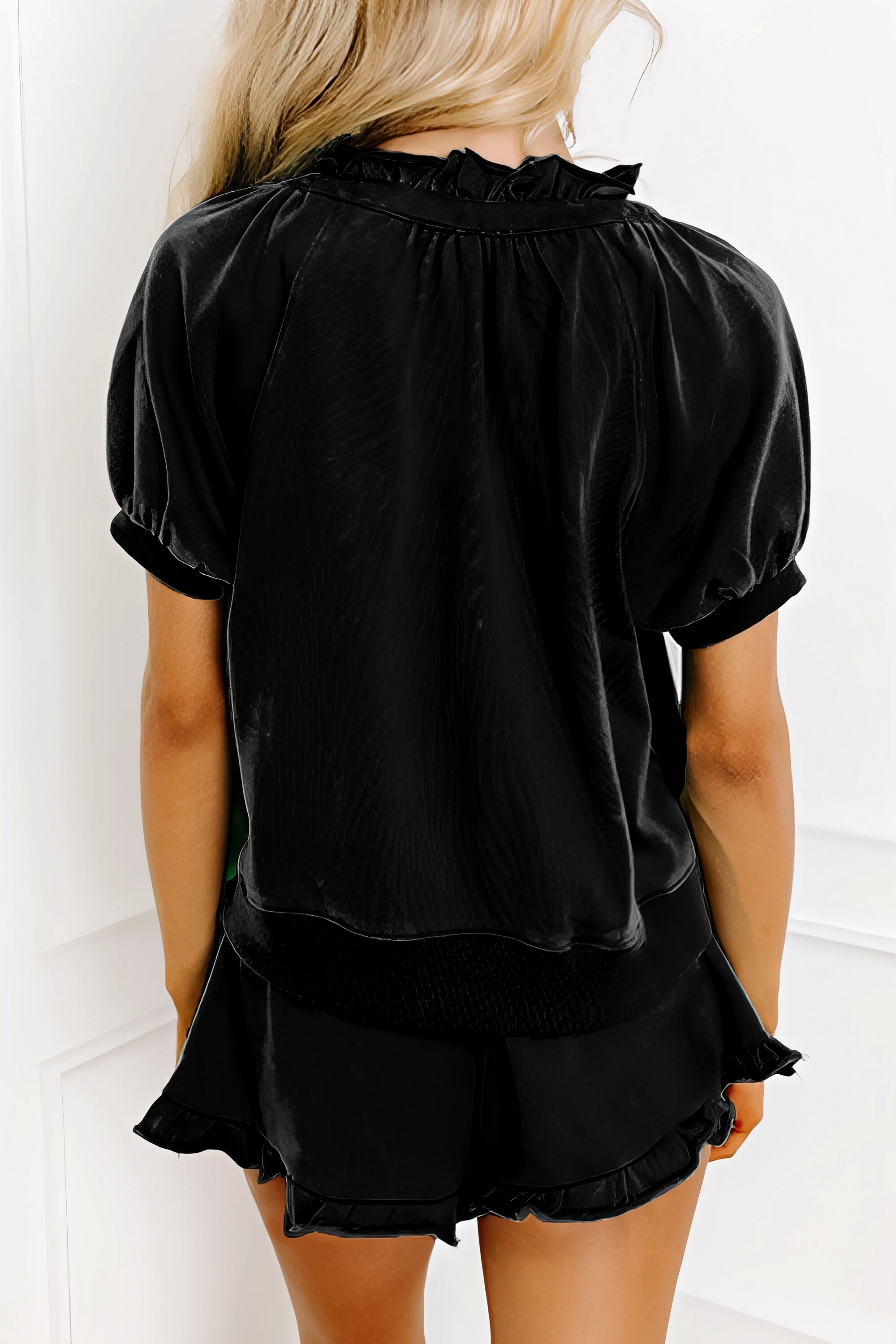 Frill zip front puff sleeve top and skort set, women's stylish two-piece outfit, feminine frill details, puff sleeves, comfortable skort, slightly stretchy fabric, polyester cotton elastane blend, perfect for a chic and playful look