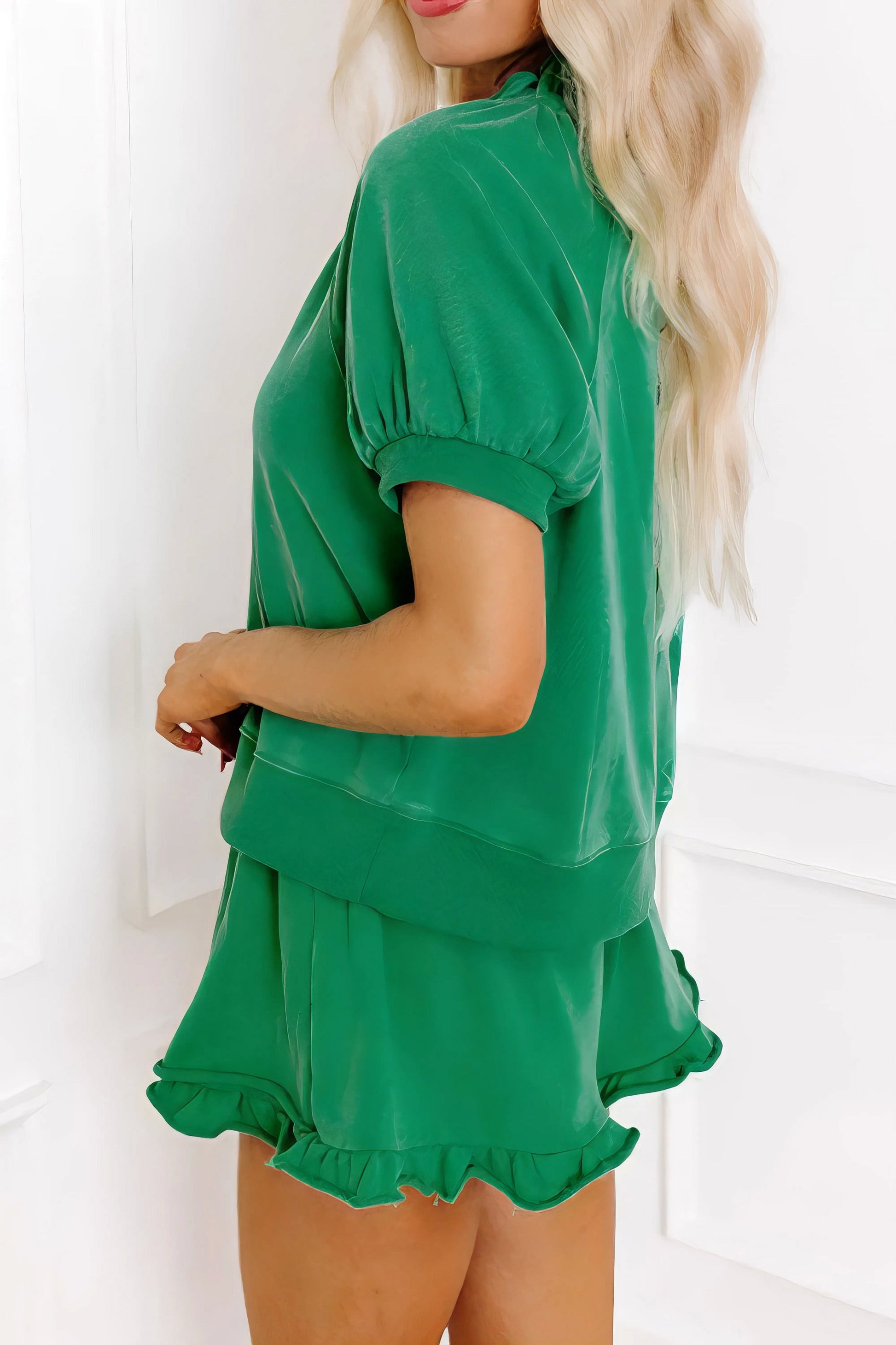 Frill zip front puff sleeve top and skort set, women's stylish two-piece outfit, feminine frill details, puff sleeves, comfortable skort, slightly stretchy fabric, polyester cotton elastane blend, perfect for a chic and playful look