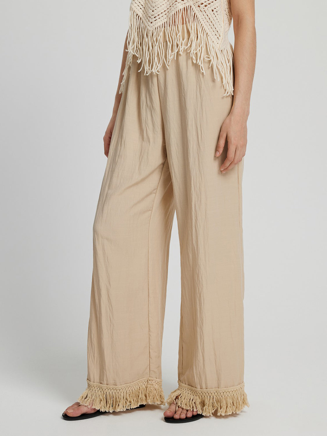 Fringe hem wide leg long pants, opaque.
