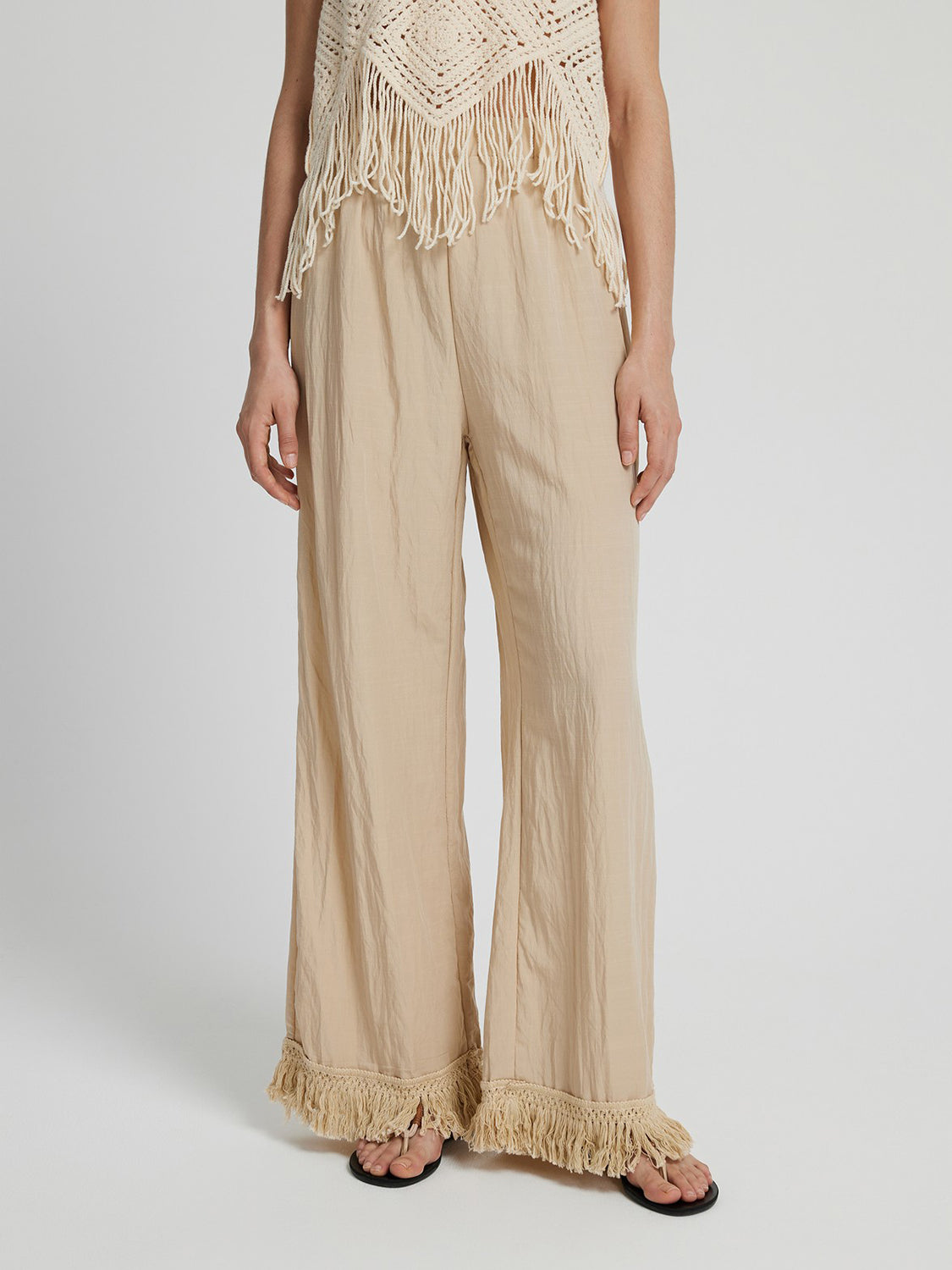 Fringe hem wide leg long pants, opaque.