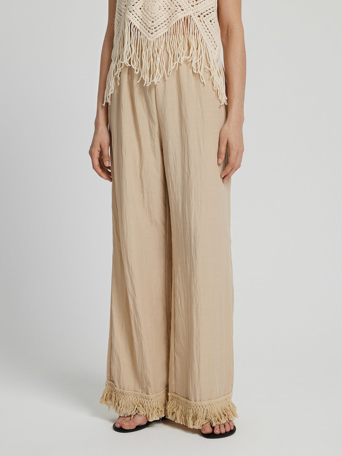 Fringe hem wide leg long pants, opaque.