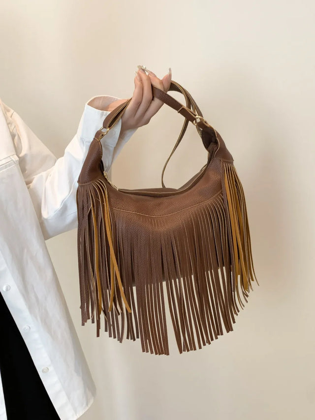 Medium PU leather fringe shoulder bag.