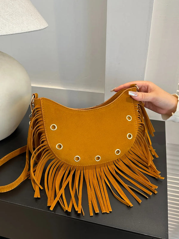 Small polyester fringe solid color shoulder bag.