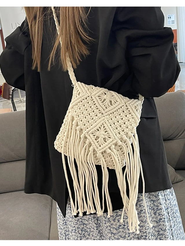 Small polyester fringe woven crossbody bag.
