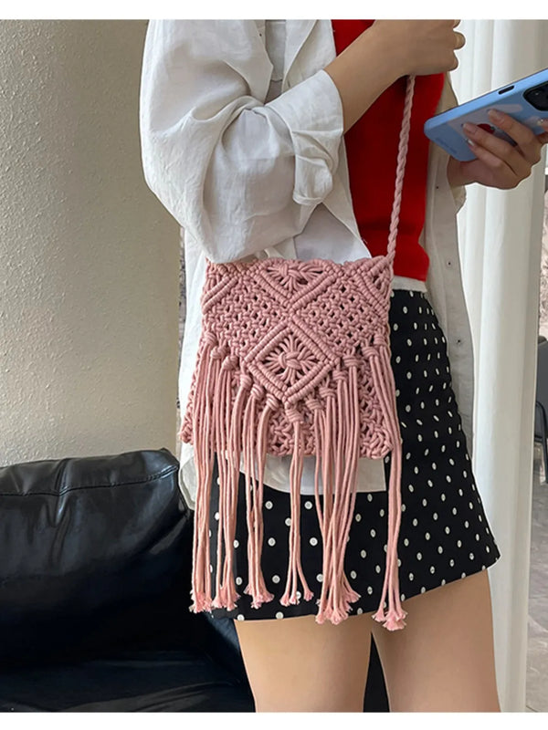 Small polyester fringe woven crossbody bag.