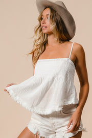 Fringed hem smocked cami with tassel detail, opaque and slightly stretchy.