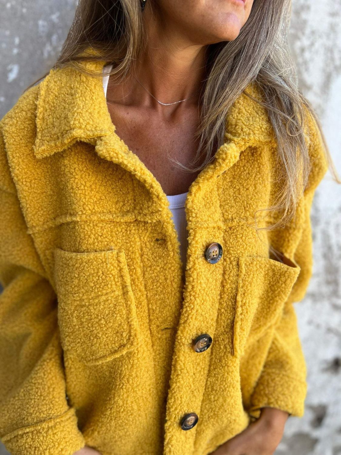Full size fuzzy button up drop shoulder jacket with pockets.