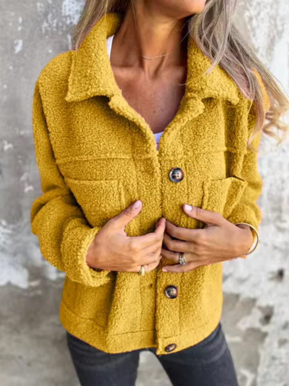 Full size fuzzy button up drop shoulder jacket with pockets.