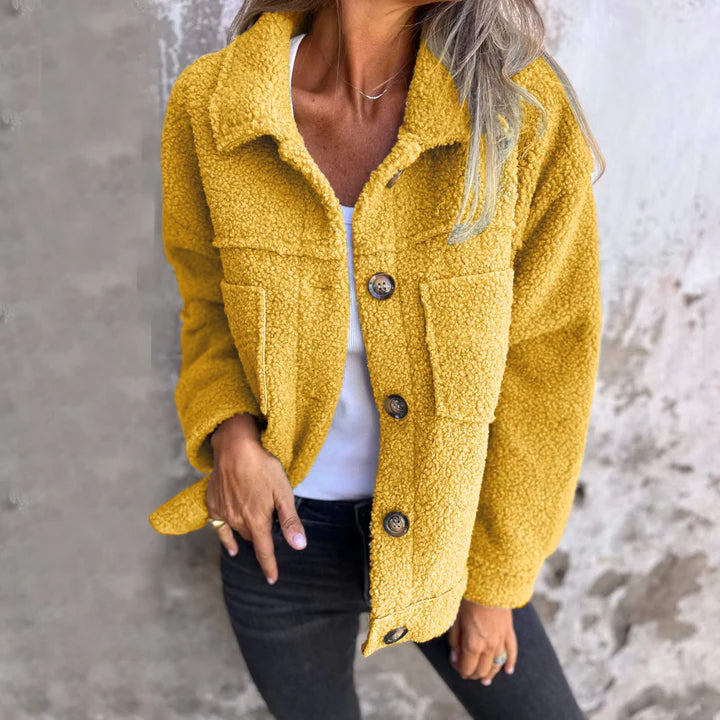 Full size fuzzy button up drop shoulder jacket with pockets.