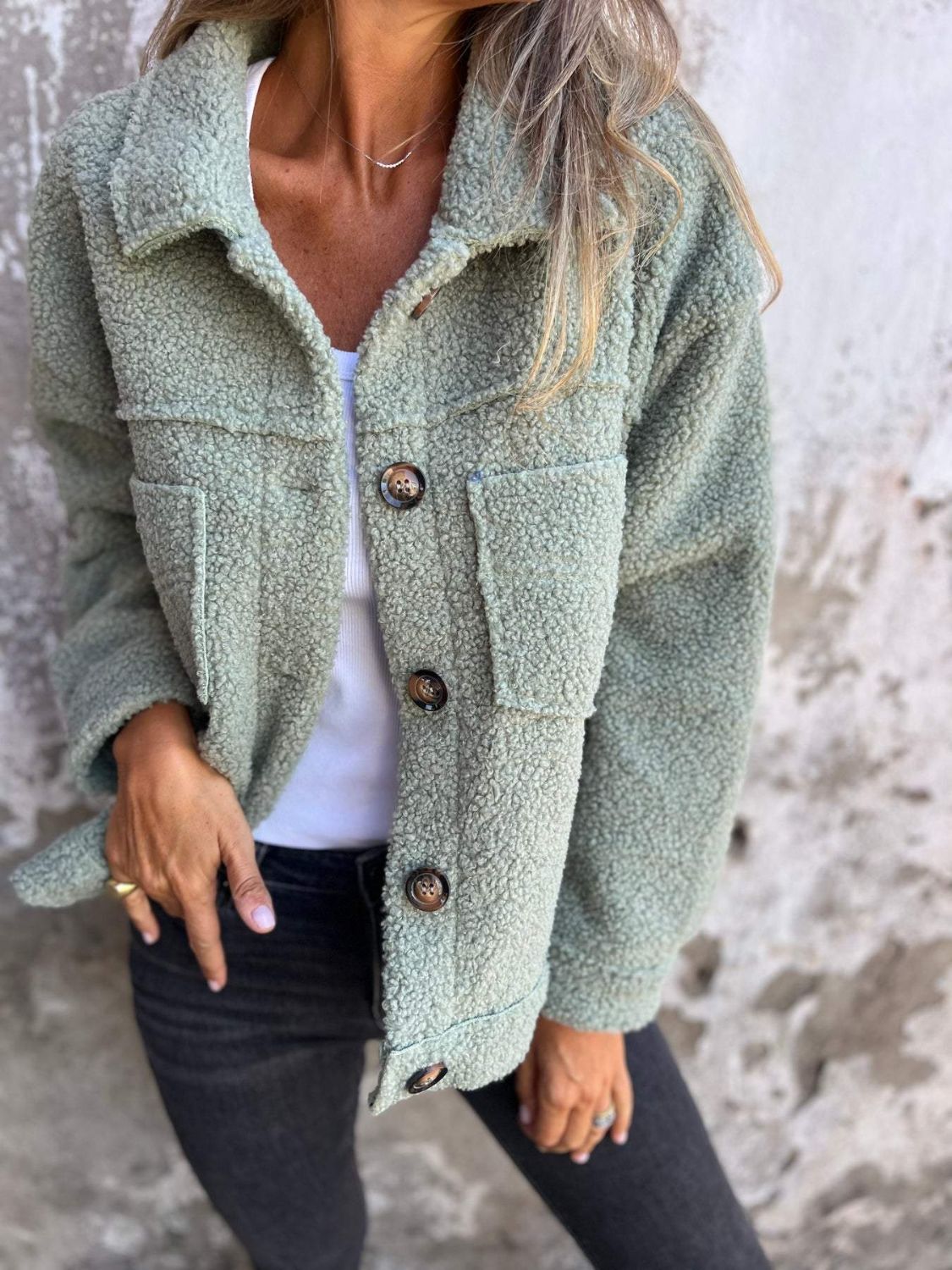 Full size fuzzy button up drop shoulder jacket with pockets.