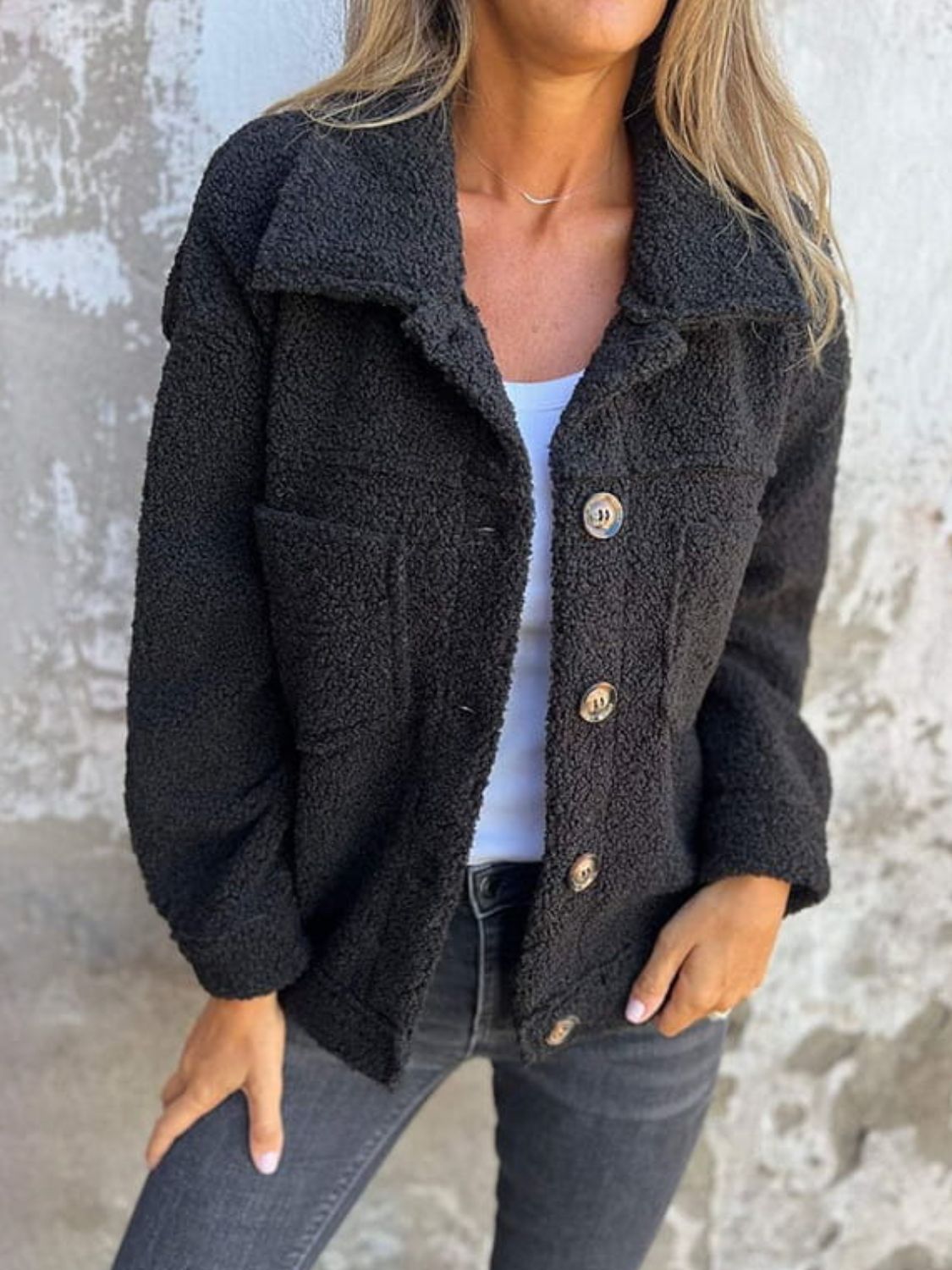 Full size fuzzy button up drop shoulder jacket with pockets.
