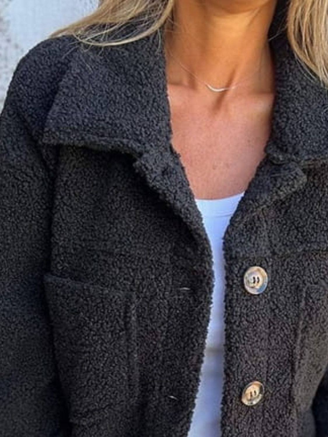 Full size fuzzy button up drop shoulder jacket with pockets.