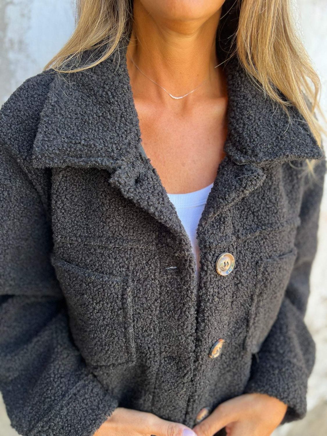 Full size fuzzy button up drop shoulder jacket with pockets.