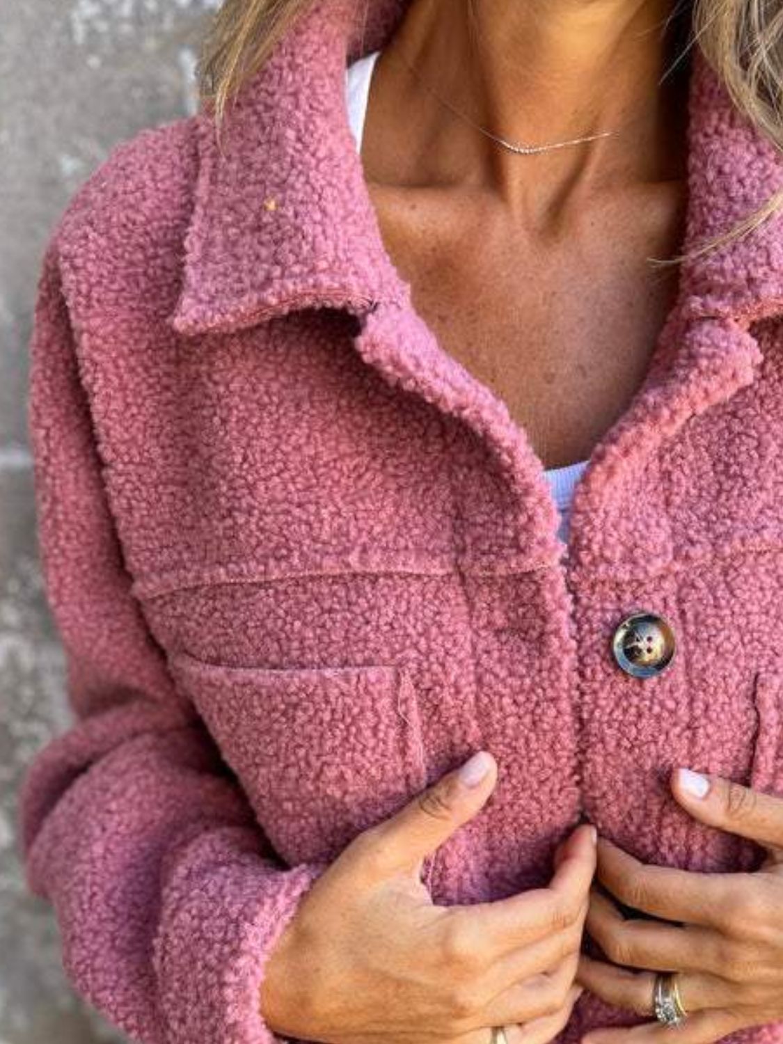 Full size fuzzy button up drop shoulder jacket with pockets.