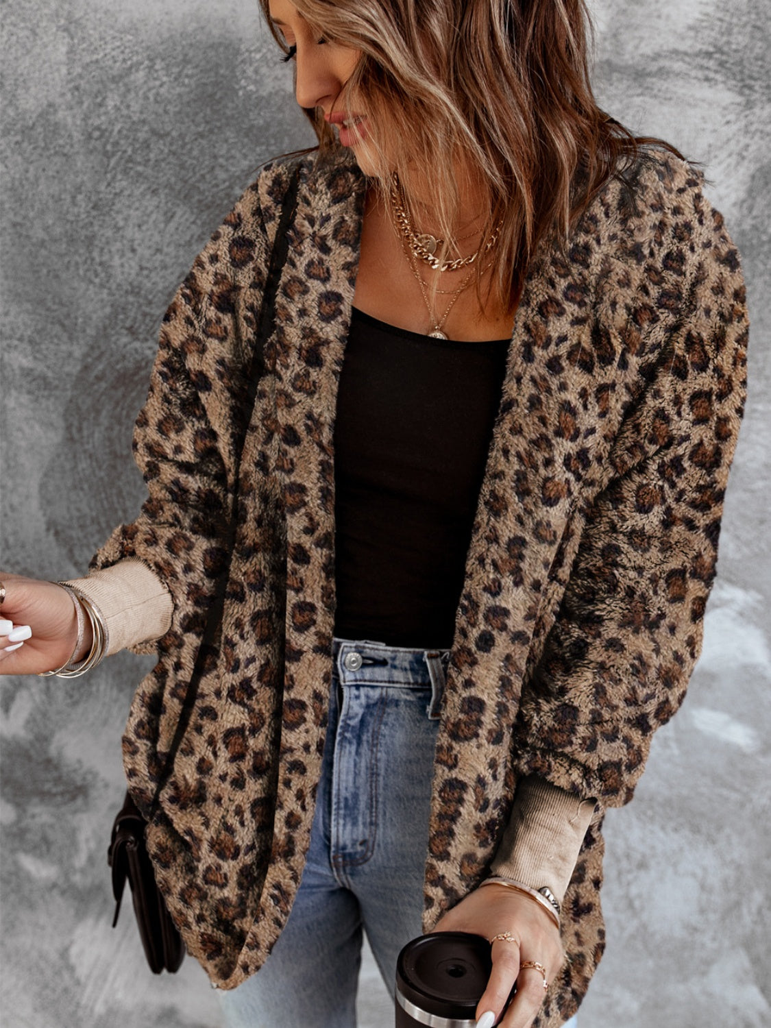 Fuzzy leopard long sleeve hooded jacket.