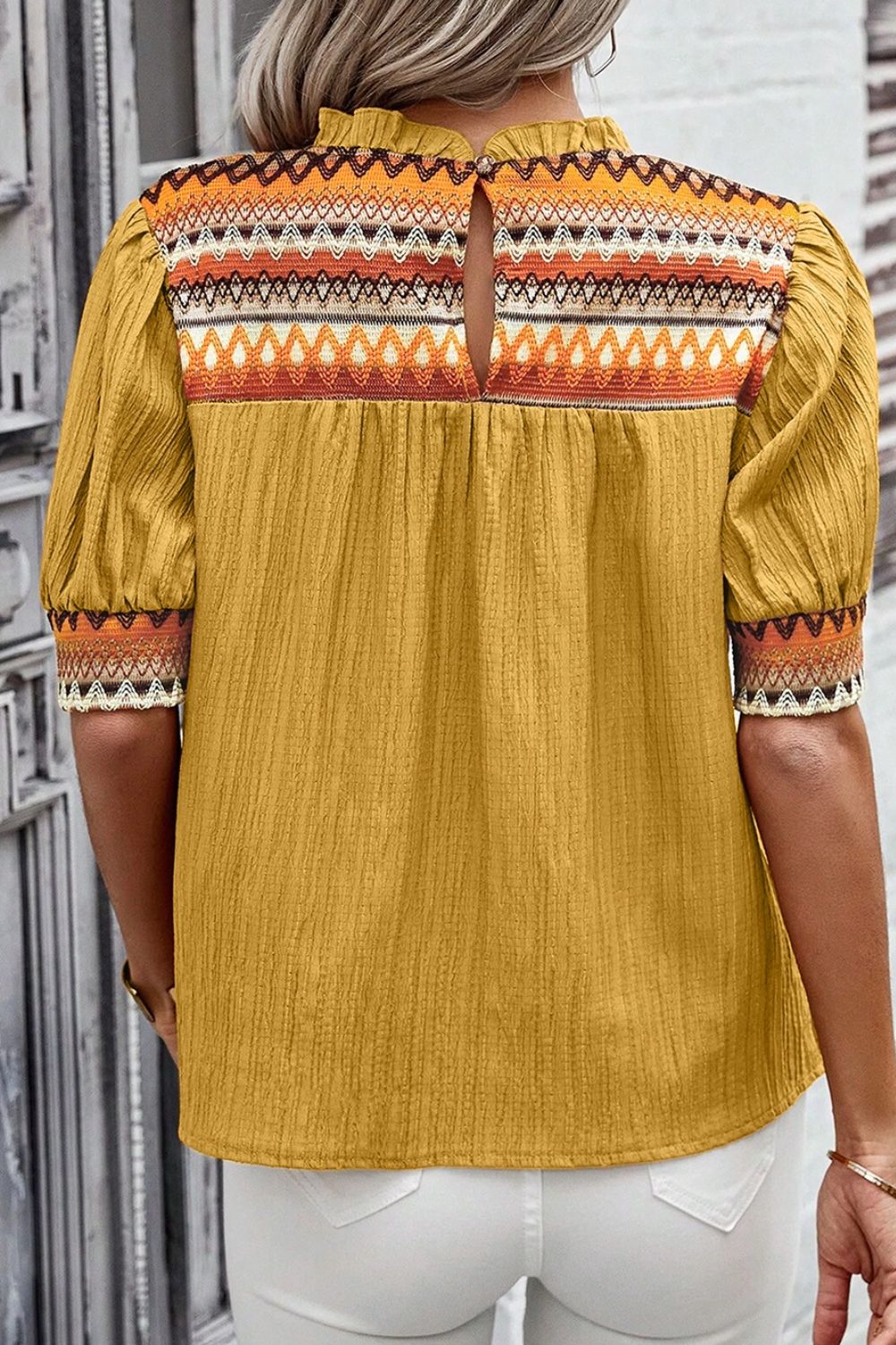 Geometric frill mock neck short sleeve blouse.