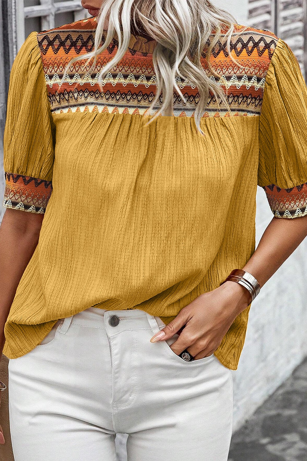 Geometric frill mock neck short sleeve blouse.