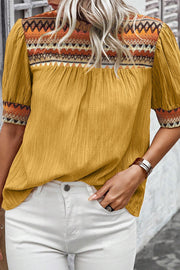 Geometric frill mock neck short sleeve blouse.