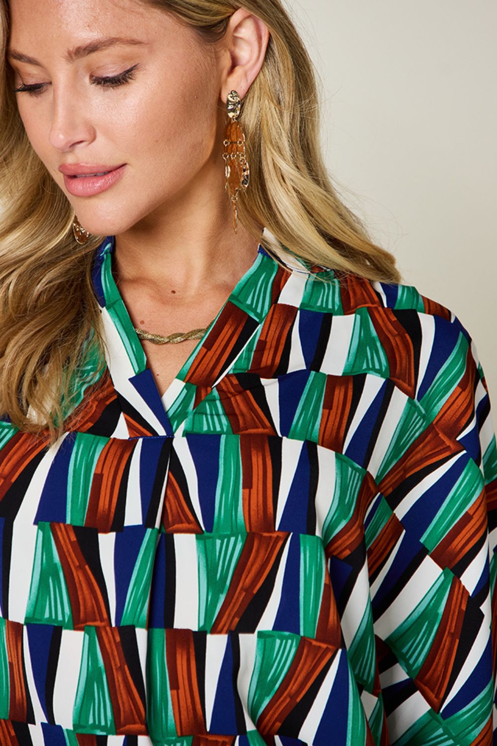 Double Take full size geometric notched dolman sleeve top.