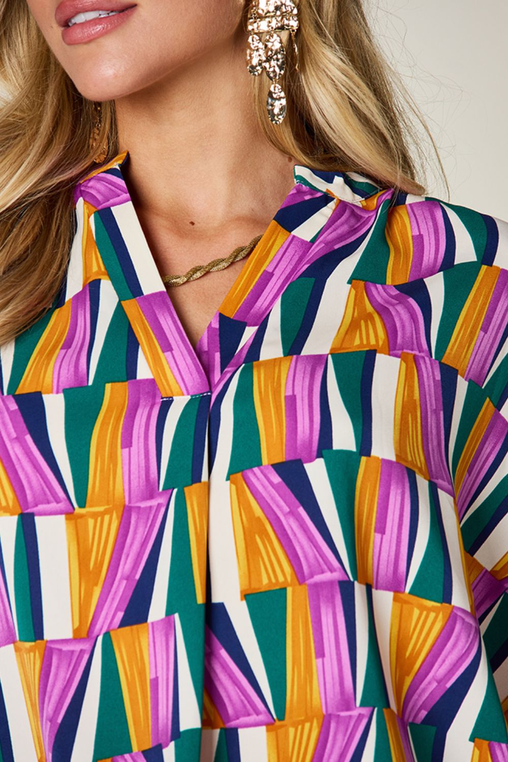 Double Take full size geometric notched dolman sleeve top.