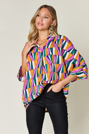 Double Take full size geometric notched dolman sleeve top.