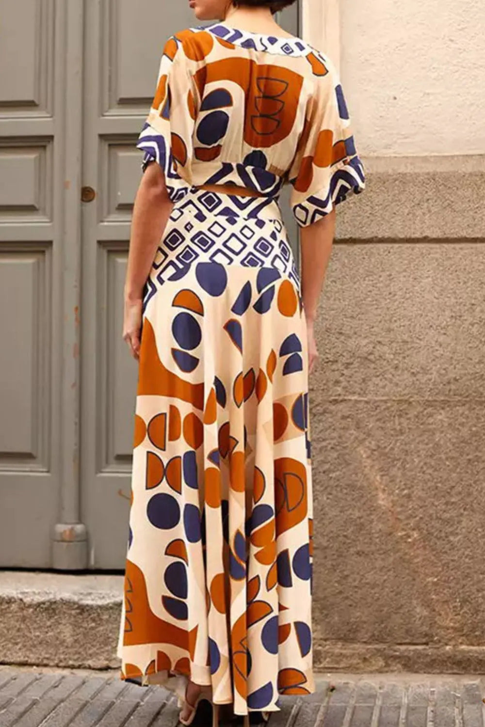 Geometric Print V-Neck Maxi Dress with Cutout Detail.