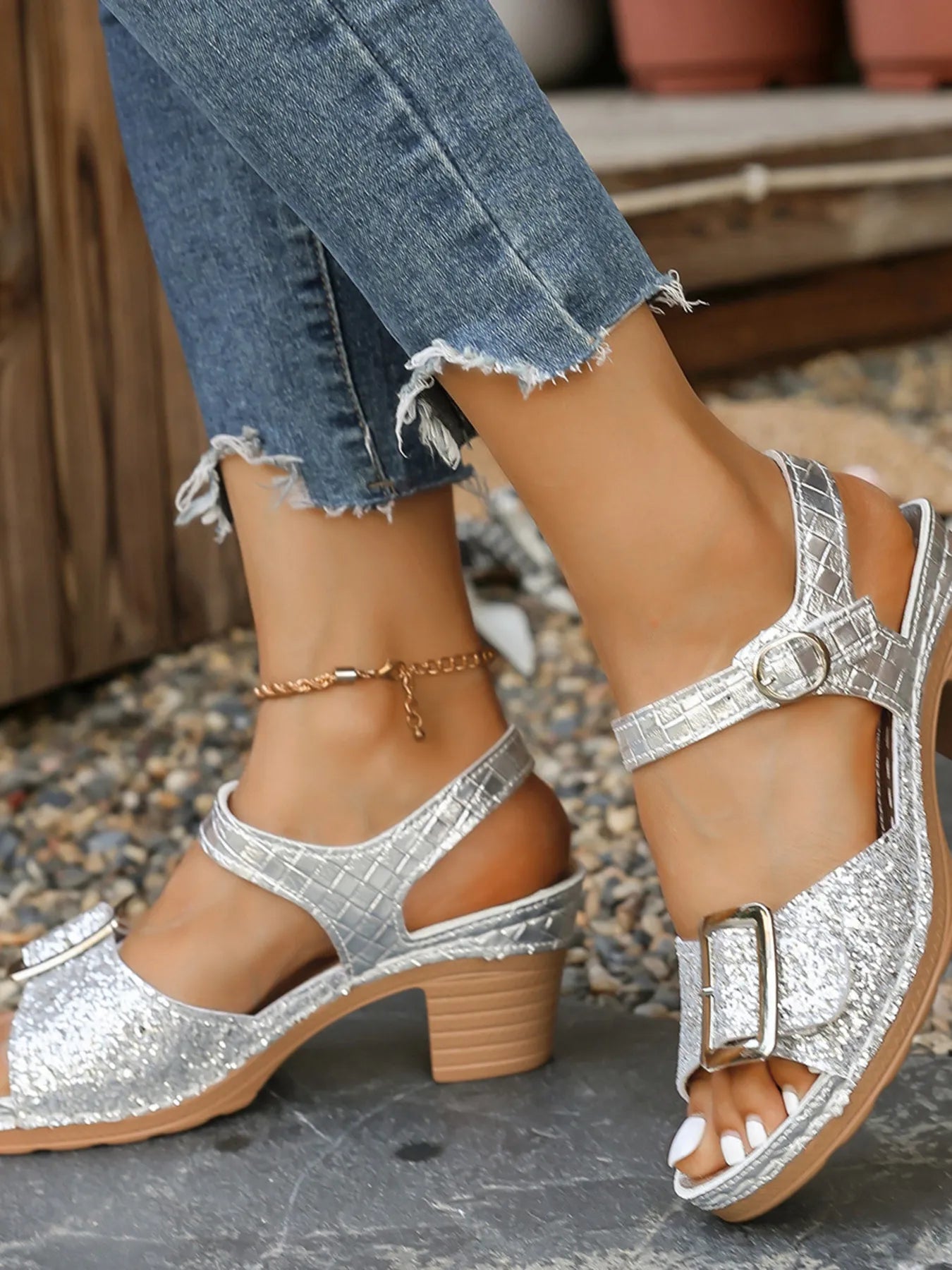 Glitter block heel buckle sandals with mid heels.