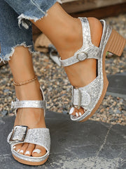 Glitter block heel buckle sandals with mid heels.