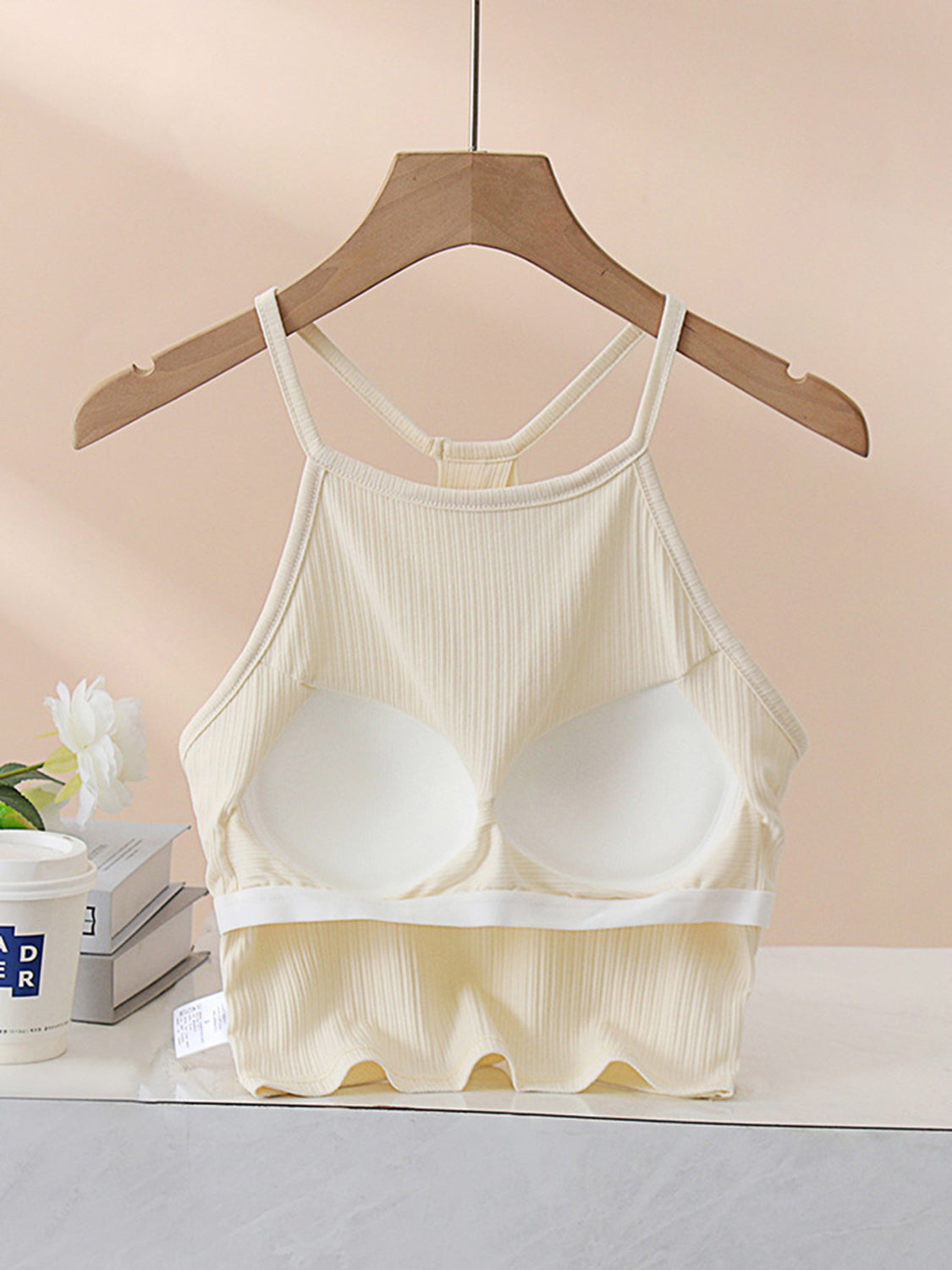 Grecian neck cropped tank top with chest pads.