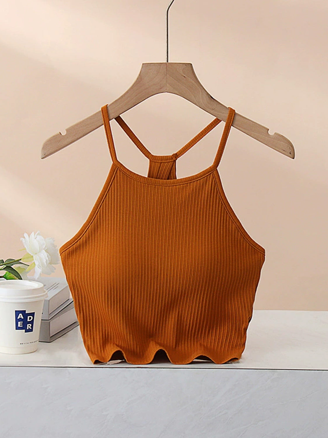 Grecian neck cropped tank top with chest pads.