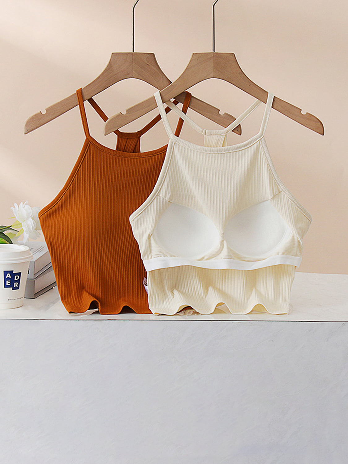 Grecian neck cropped tank top with chest pads.