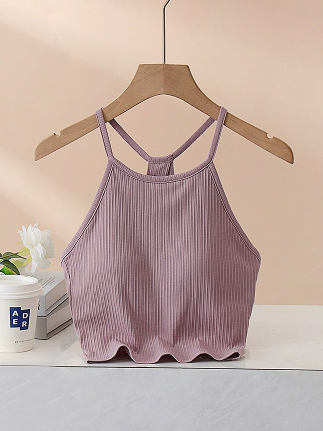 Grecian neck cropped tank top with chest pads.