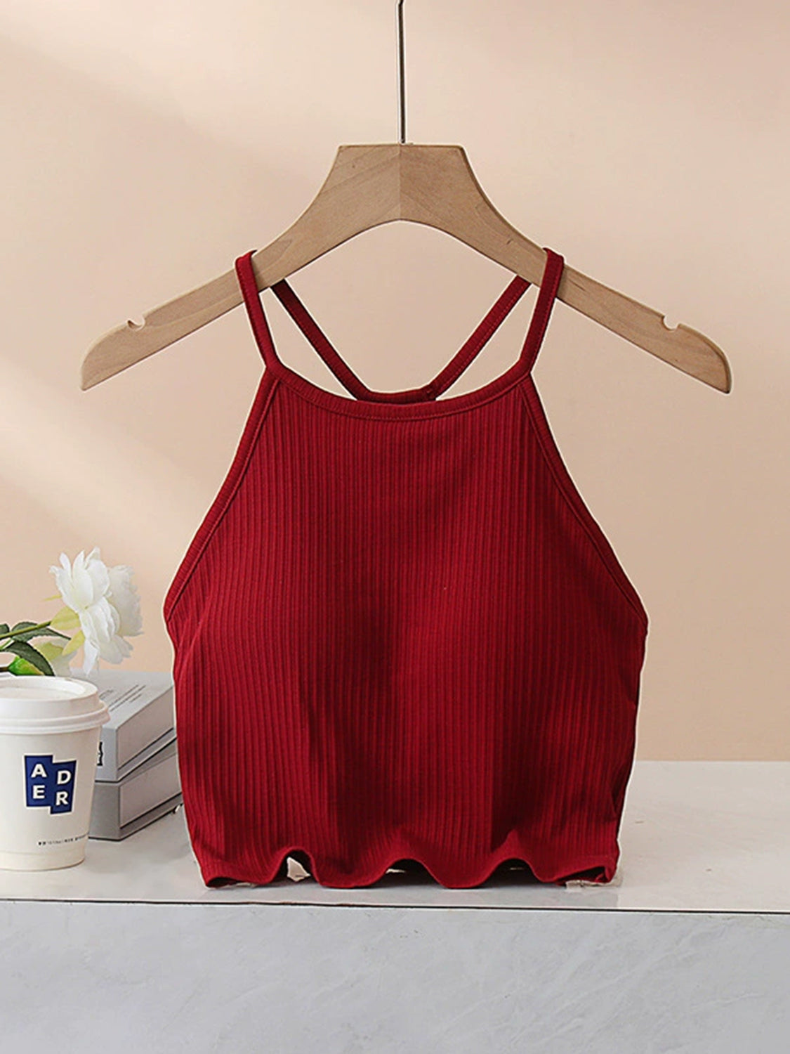 Grecian neck cropped tank top with chest pads.
