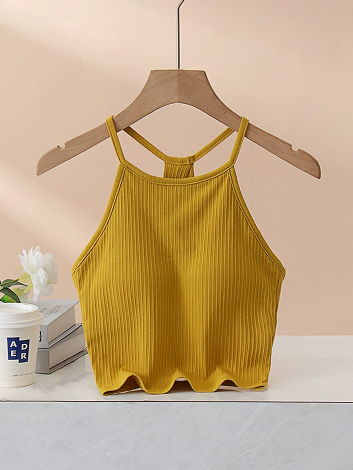 Grecian neck cropped tank top with chest pads.