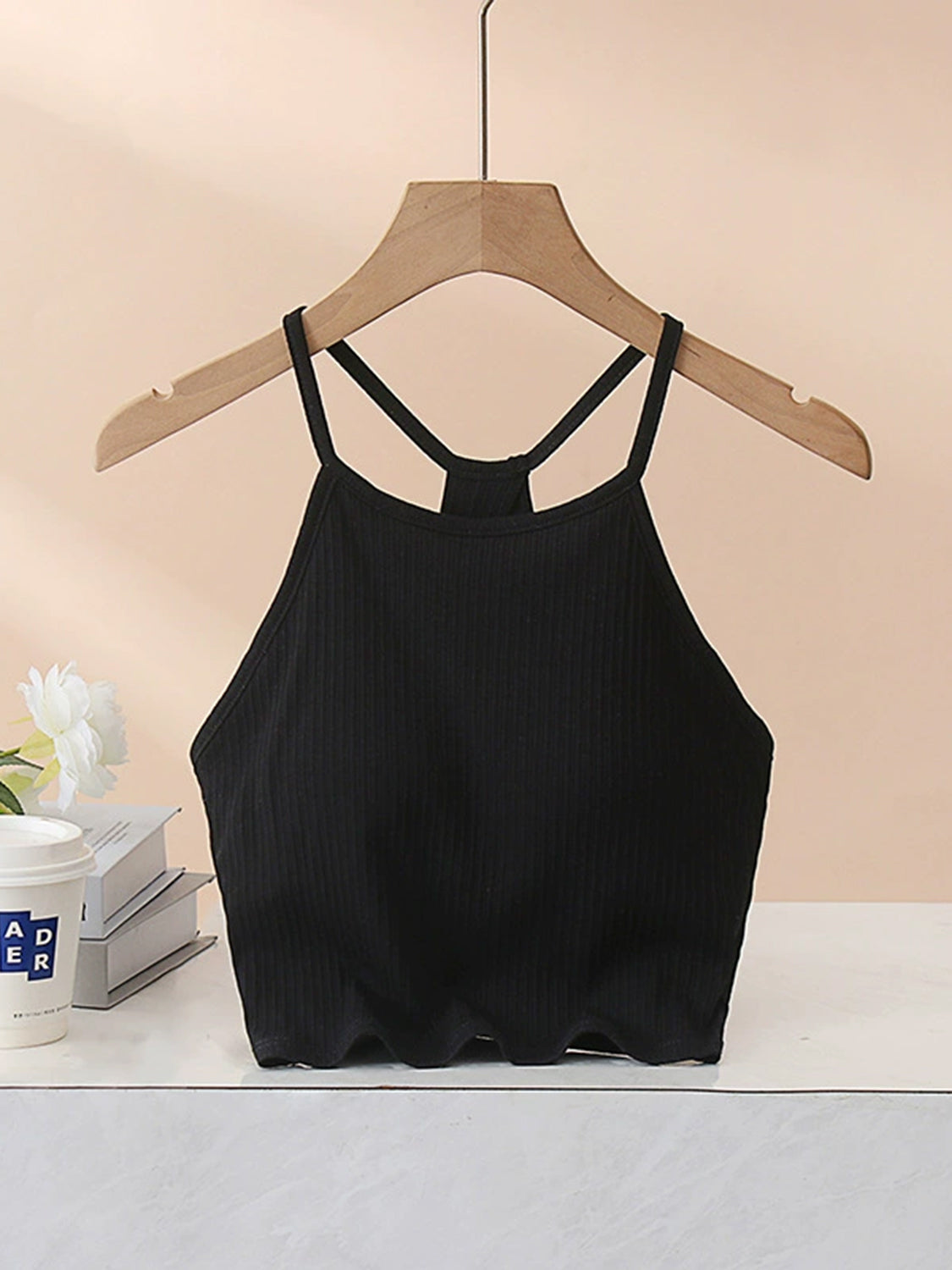 Grecian neck cropped tank top with chest pads.