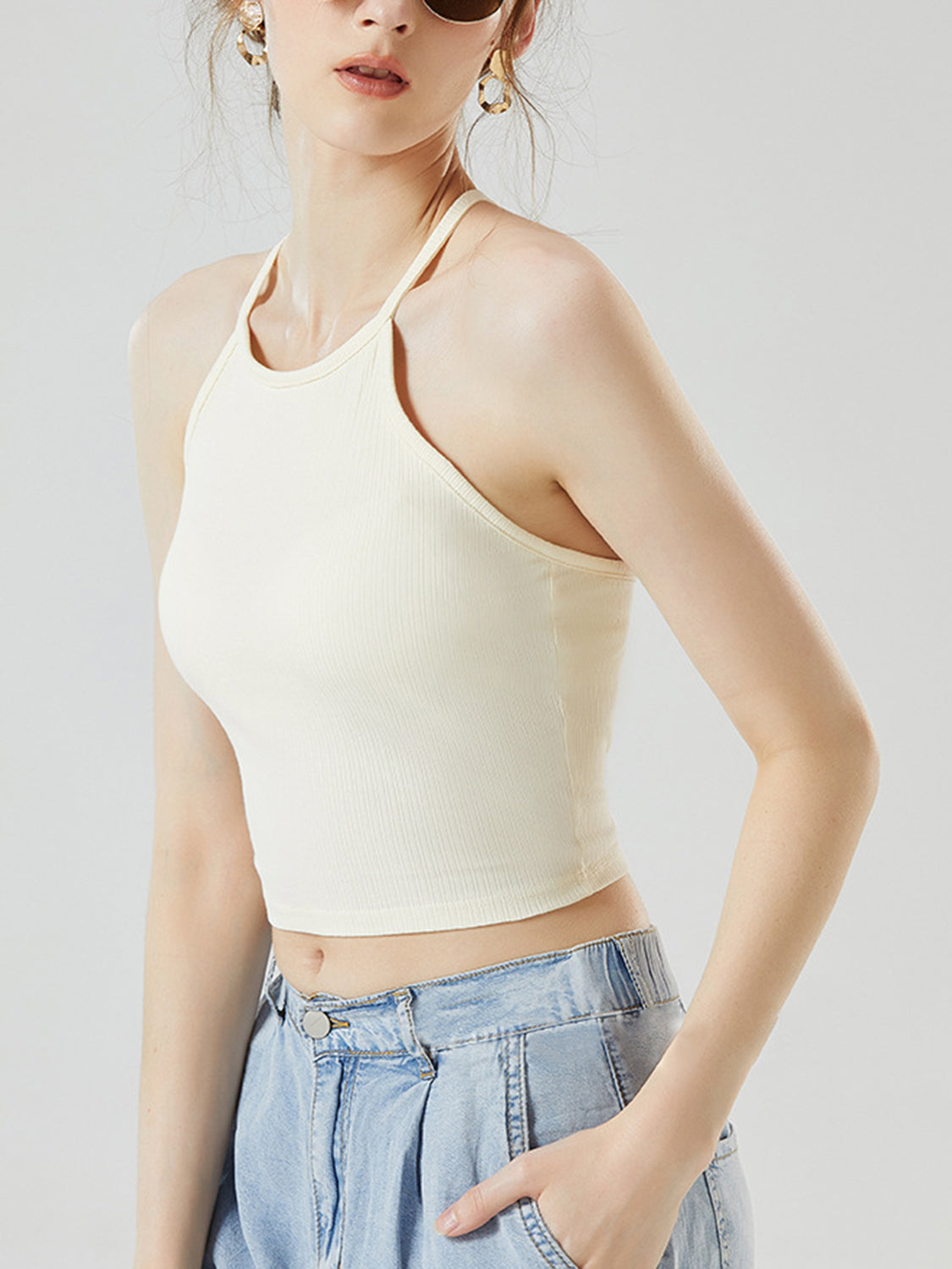 Grecian neck cropped tank top with chest pads.