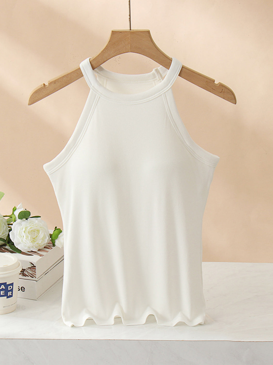 Grecian neck tank top with chest pads.