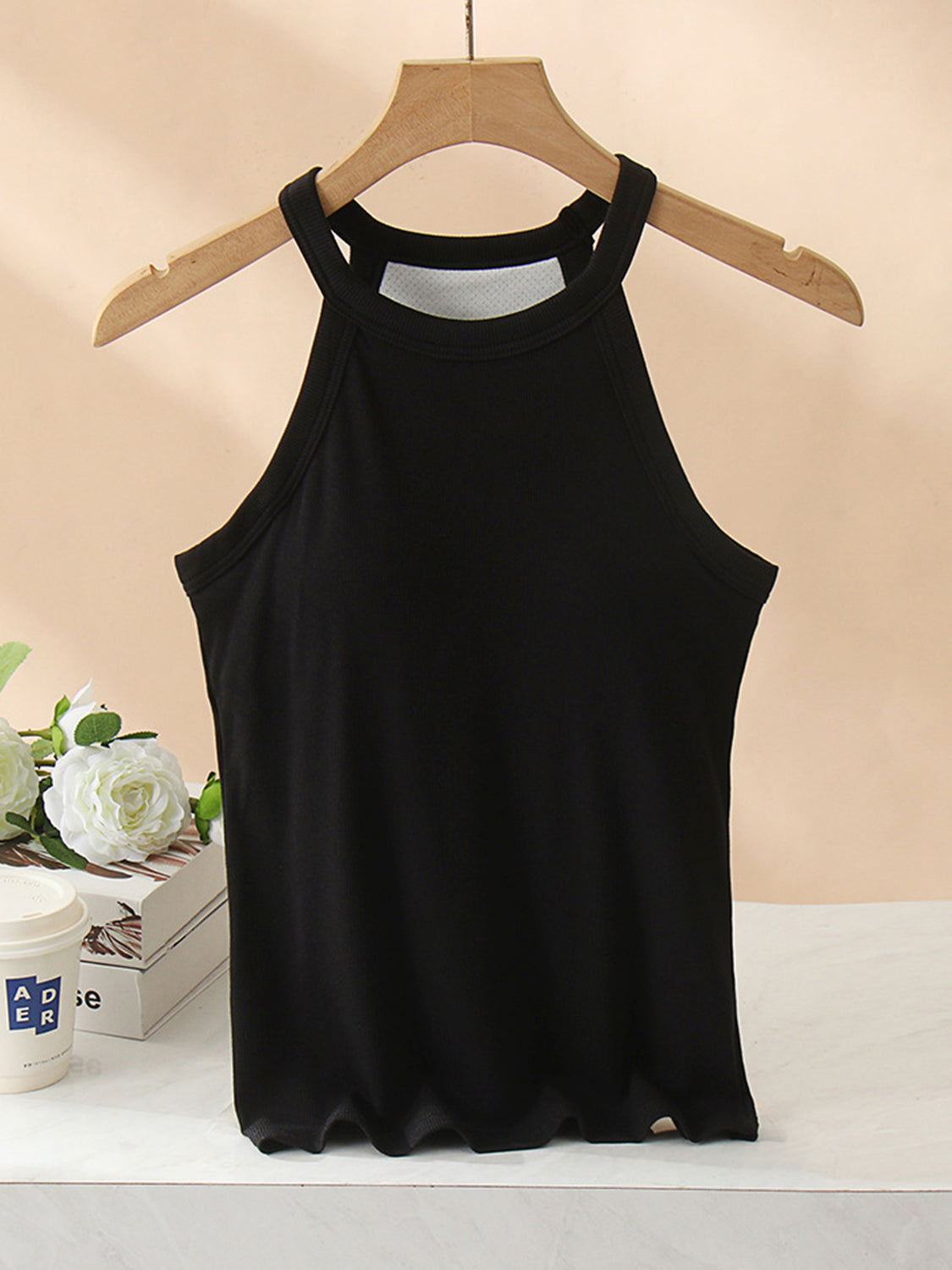 Grecian neck tank top with chest pads.