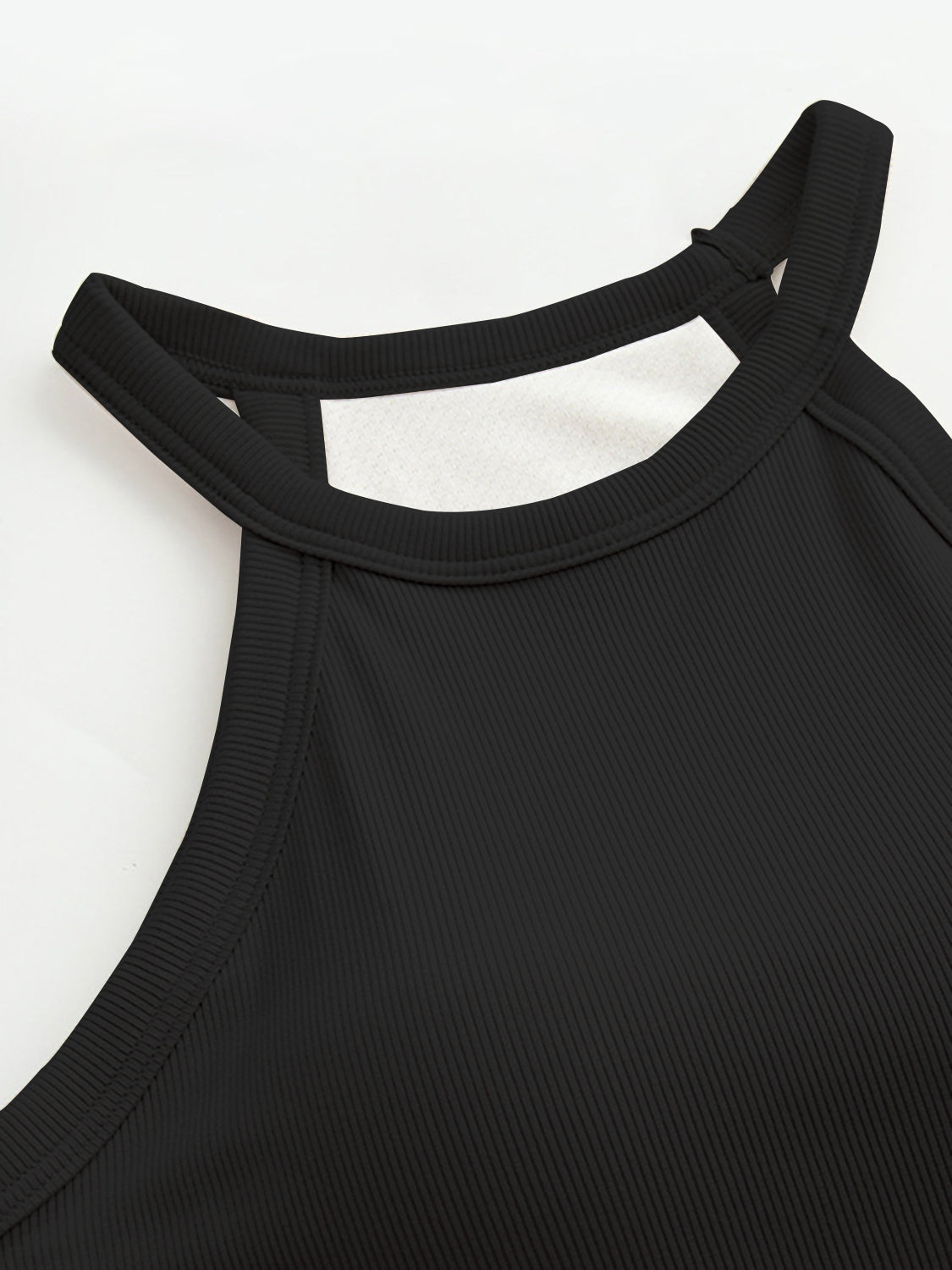 Grecian neck tank top with chest pads.