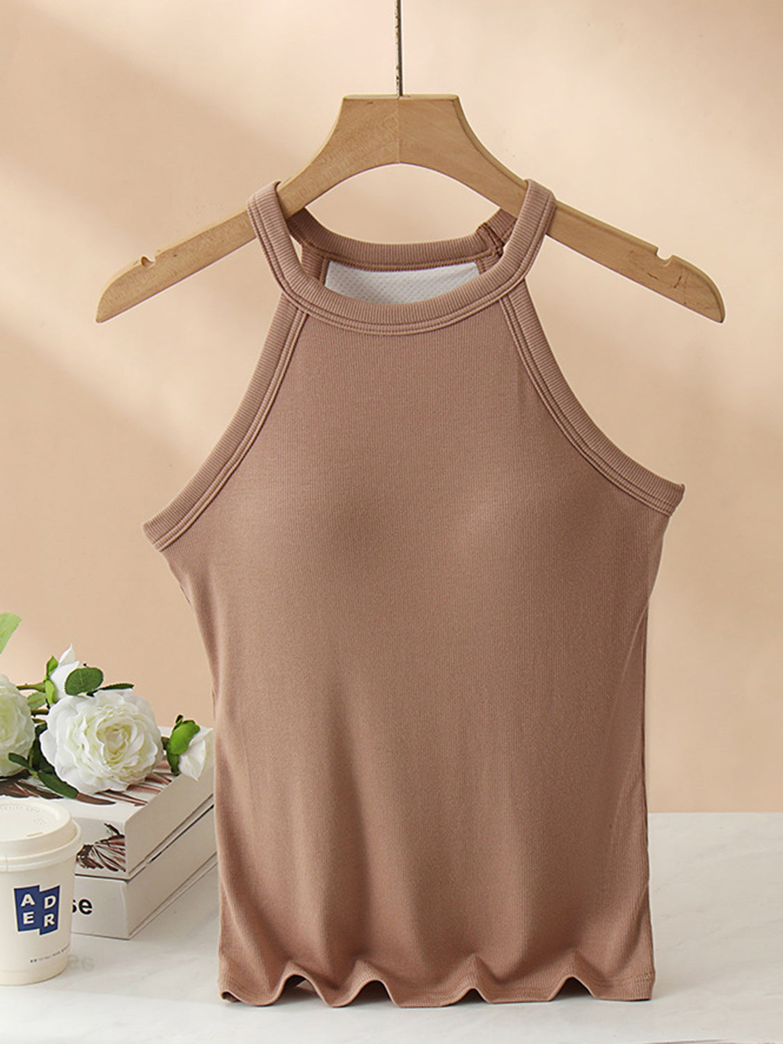 Grecian neck tank top with chest pads.