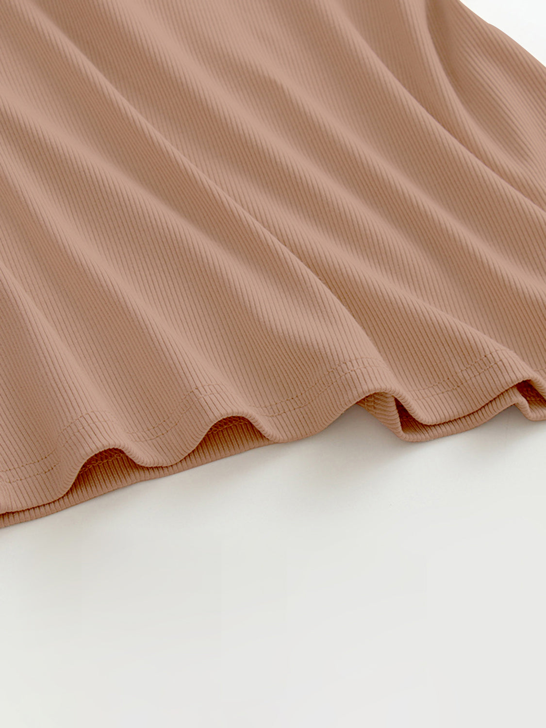 Grecian neck tank top with chest pads.