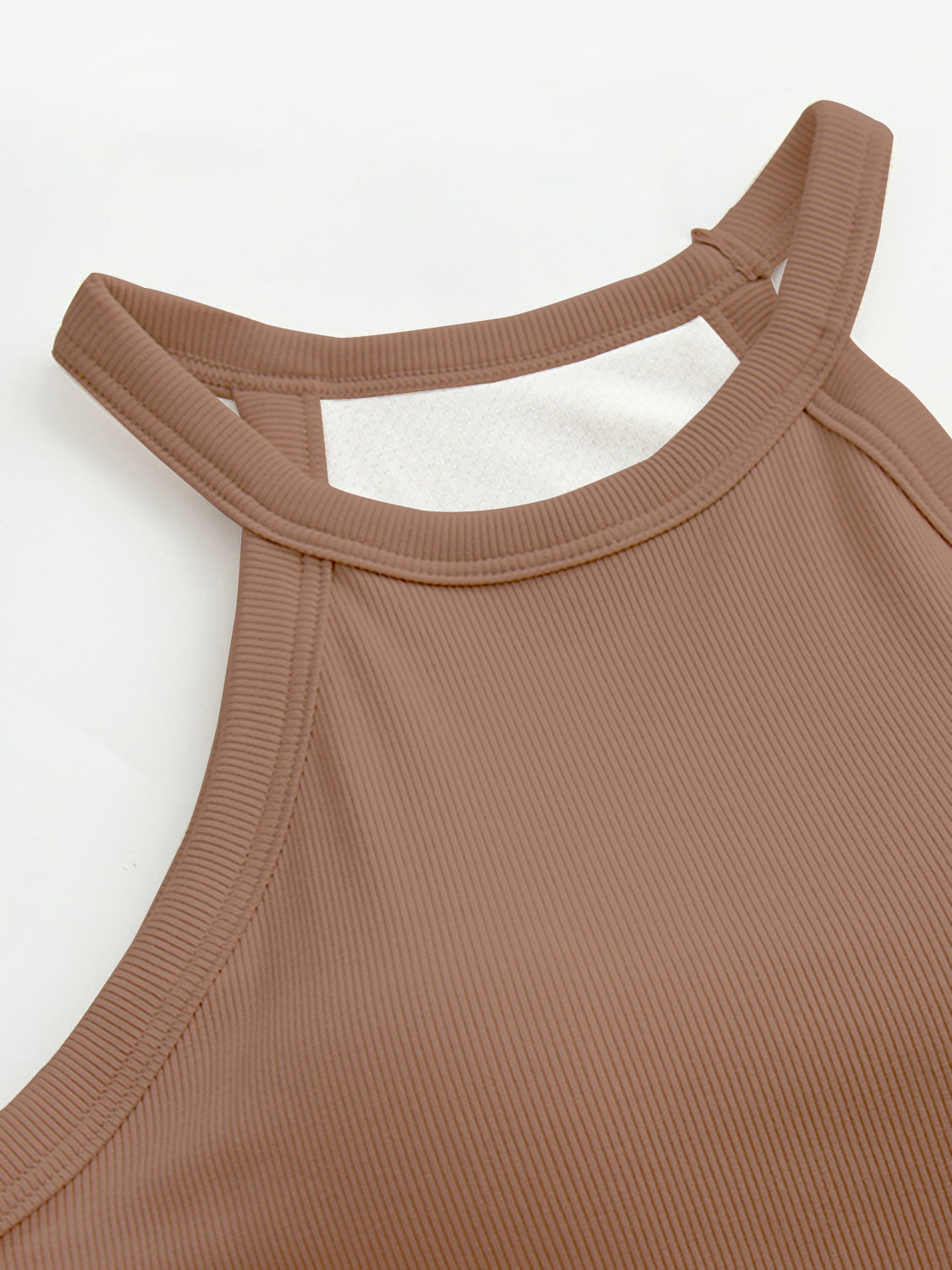Grecian neck tank top with chest pads.