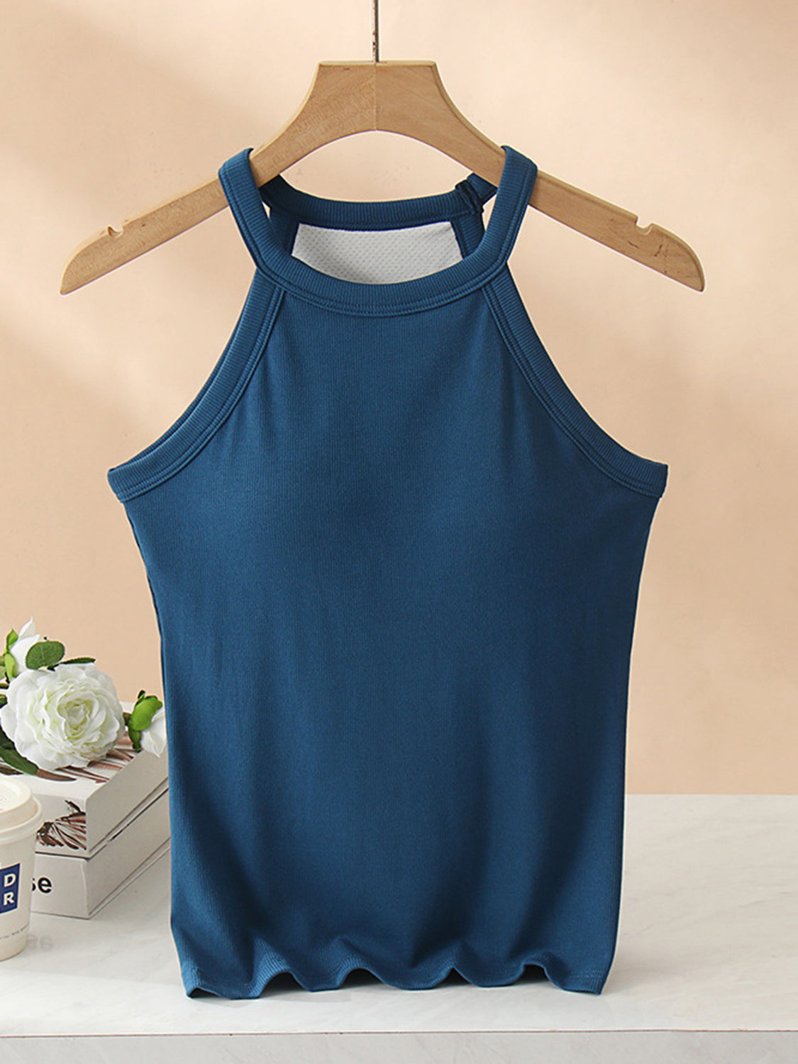 Grecian neck tank top with chest pads.