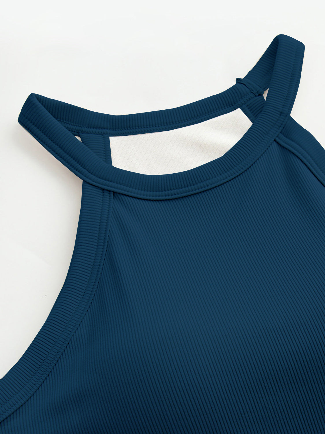 Grecian neck tank top with chest pads.