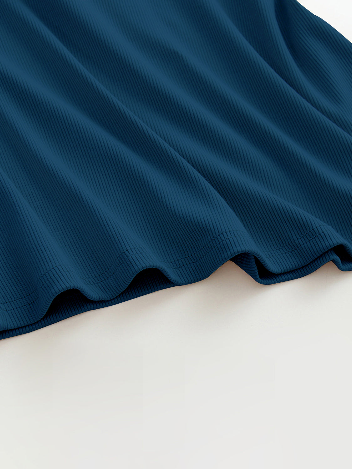 Grecian neck tank top with chest pads.
